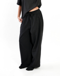 Minstreet unisex wide-leg black sweatpants with drawstring waist, worn with a black tee